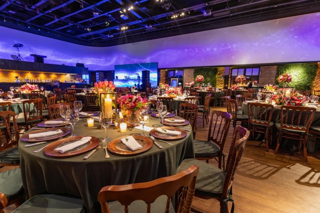 Beautifully decorated wedding reception with floral arrangements and luxurious table settings.